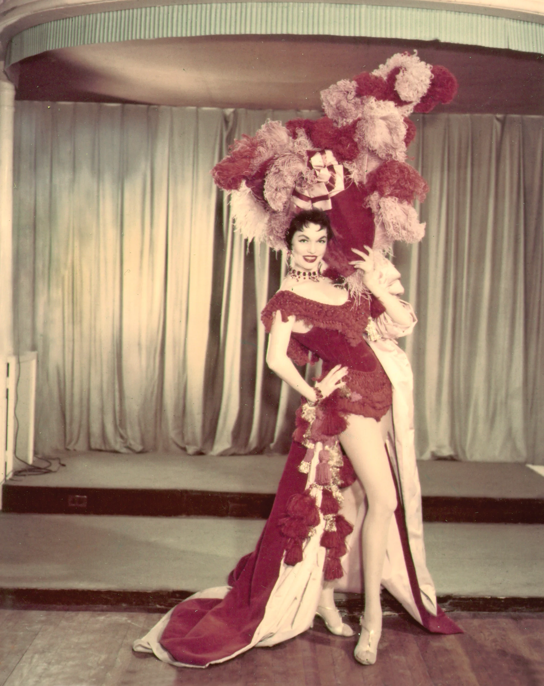 Unfurling my dad’s lengthy legs (I always wished I’d inherited Mom’s) beneath an explosion of feathers during the revival of The Ziegfeld Follies.  No acting required, but who cared? It was Broadway!